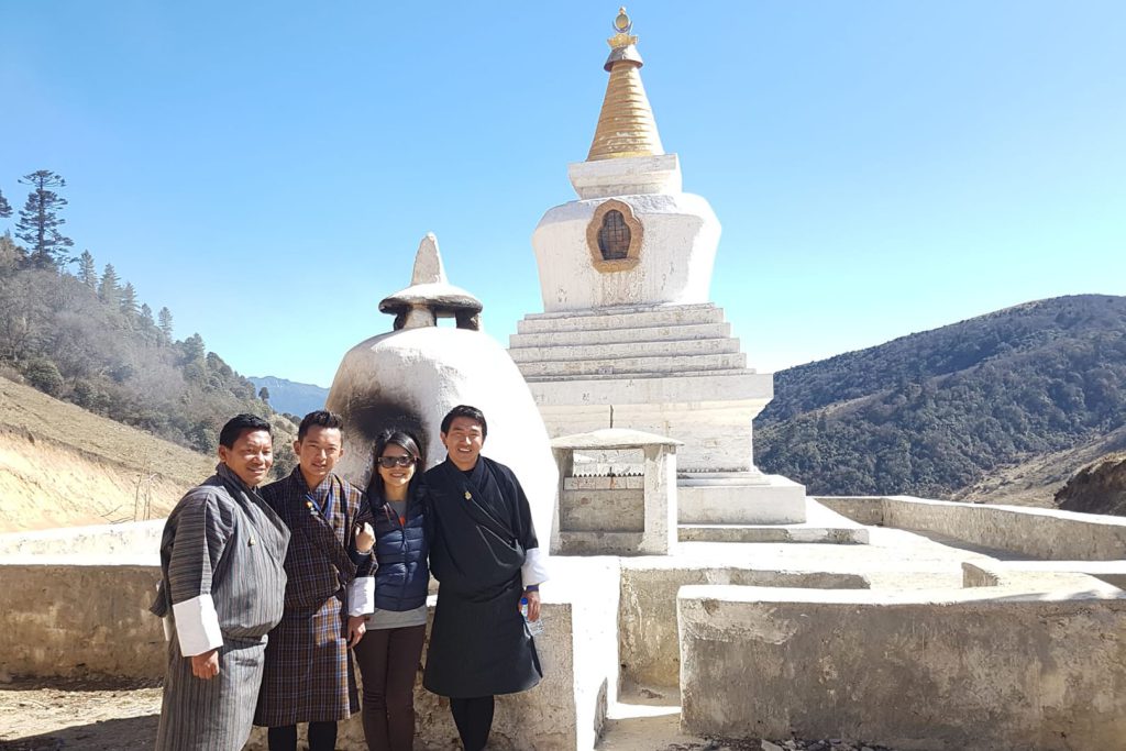 Tourist and guide in front of choerten laya trek