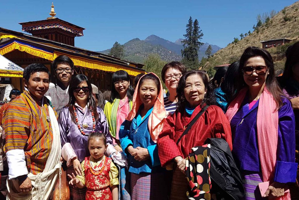 Tourist and guide in front of monastery laya trek