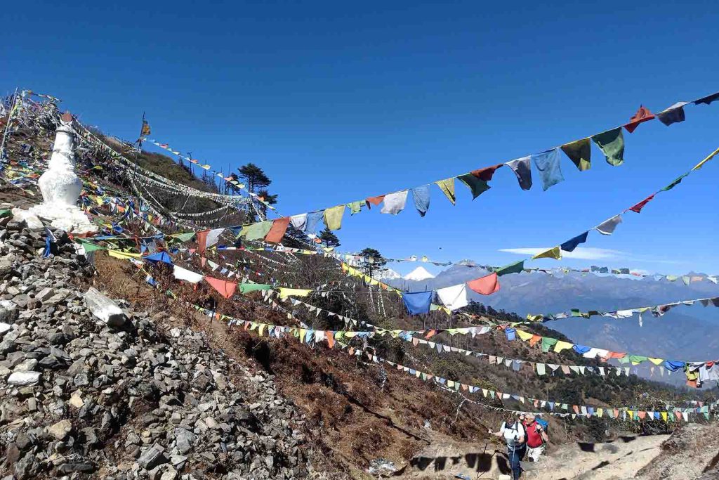 Prayer flags and mountain view gangtey trek